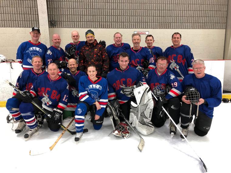 Team photos on the ice in OAC '84 jerseys