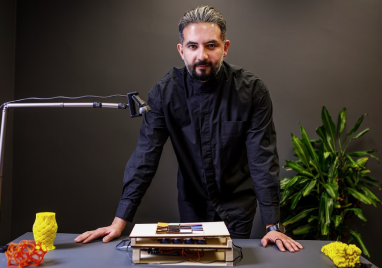 afshin ashair, standing in front of his artificial intelligence tool