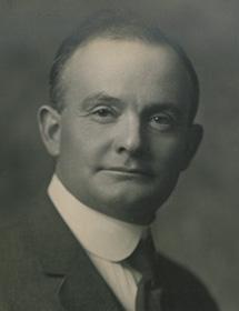 Ernest Charles Drury black and white headshot.