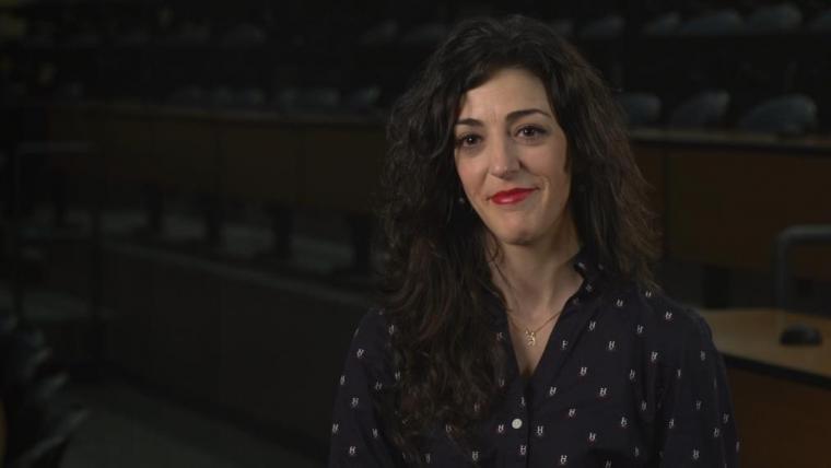 Angela Canovas sitting in dark room