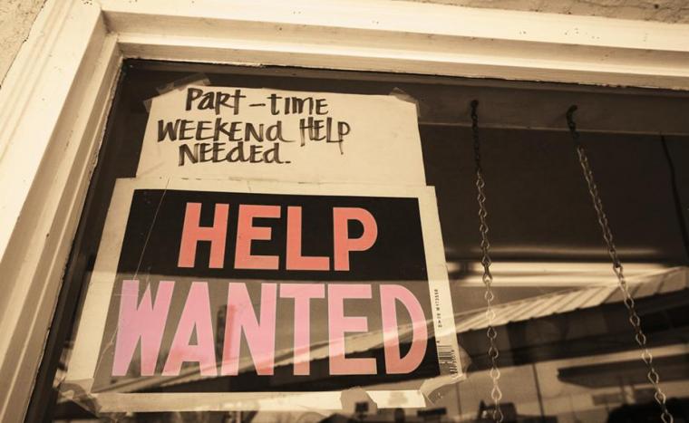 Help Wanted sign with note that says "Part-time weekend help needed"