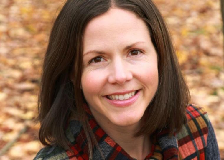 Kimberley Schneider head shot, fall leaves in background