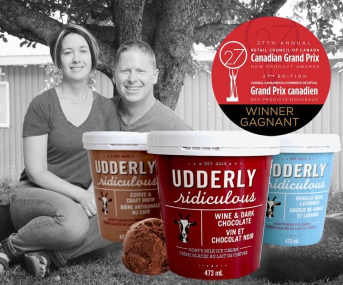 Greg and Cheryl Haskett with Udderly Ridiculous ice cream containers and Canadian Grand Prix award badge