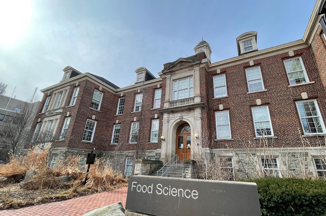 A historic and large brick building with a sign that says Food Science.