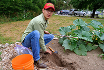 Fernando Montaño Lopez taking soil samples from a community garden plot.