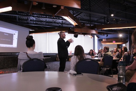 Students listening to a speaker