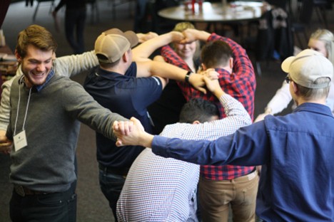 Students playing a game of knots
