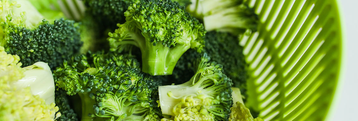 Broccoli in a colander.