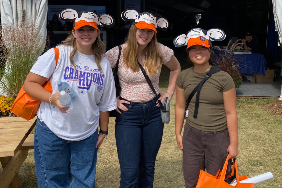 davina with three classmates - each of them are wearing a cow ear hat