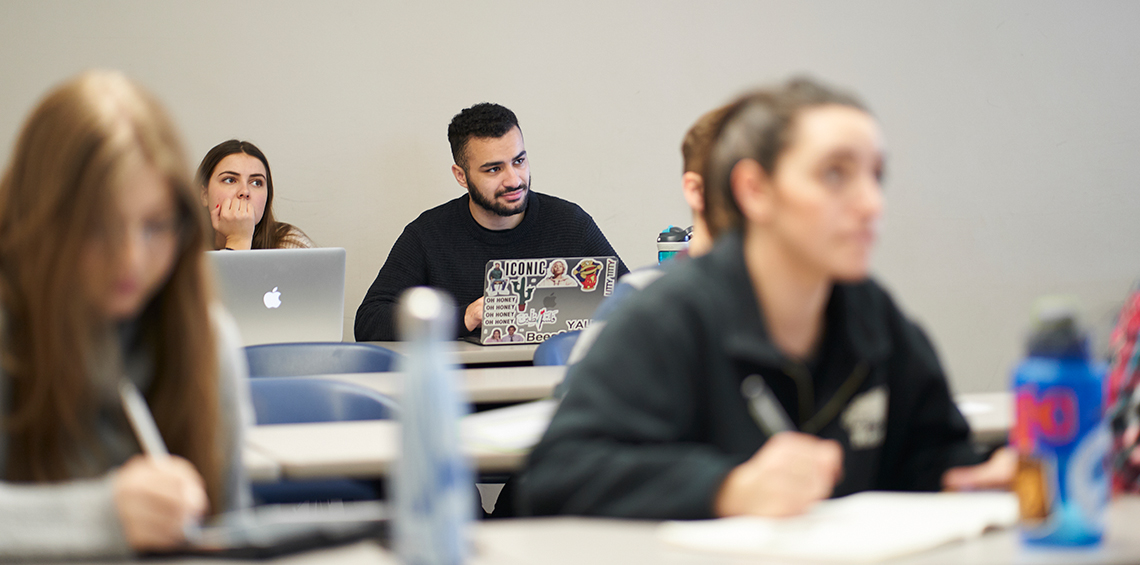 Students sitting in a class lecture.