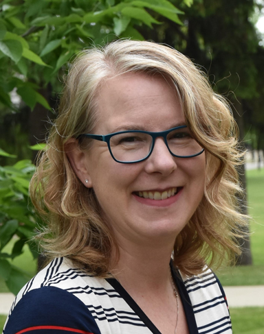 Dr. Laura van Eerd outside in green space