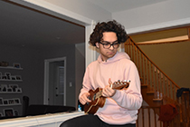 Stephen playing the ukulele.