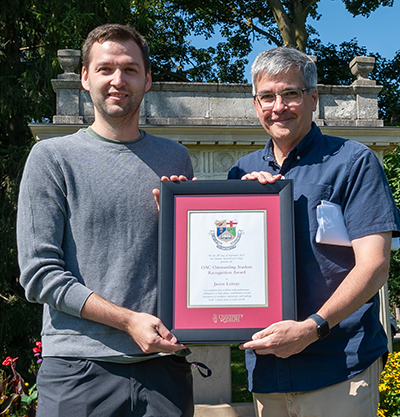 jason lemay and john cranfield holding an award plaque