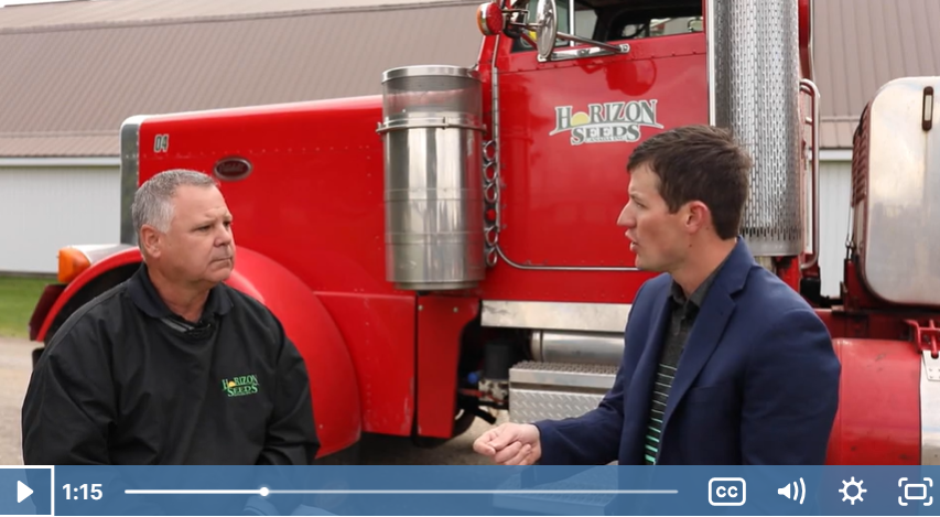 a screenshot of the UTENSIL video featuring two people at a farm infront of a truck