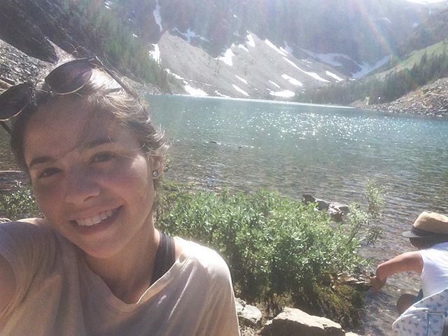 A selfie of Andrea with Lake Louise behind her. 