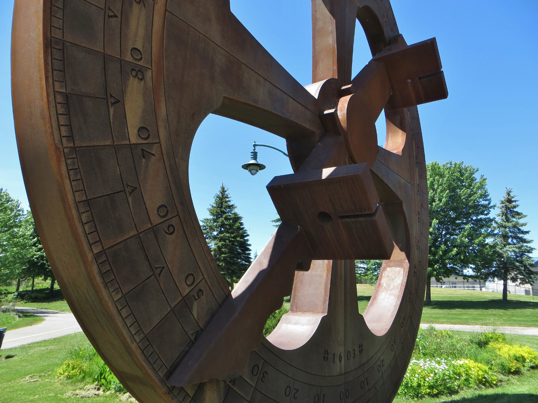 Large iron sculpture of an astrolab (wheel shaped)