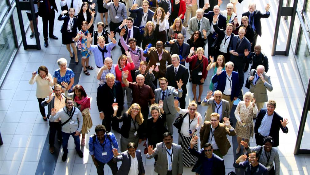 IFAMA conference attendees wave from below.