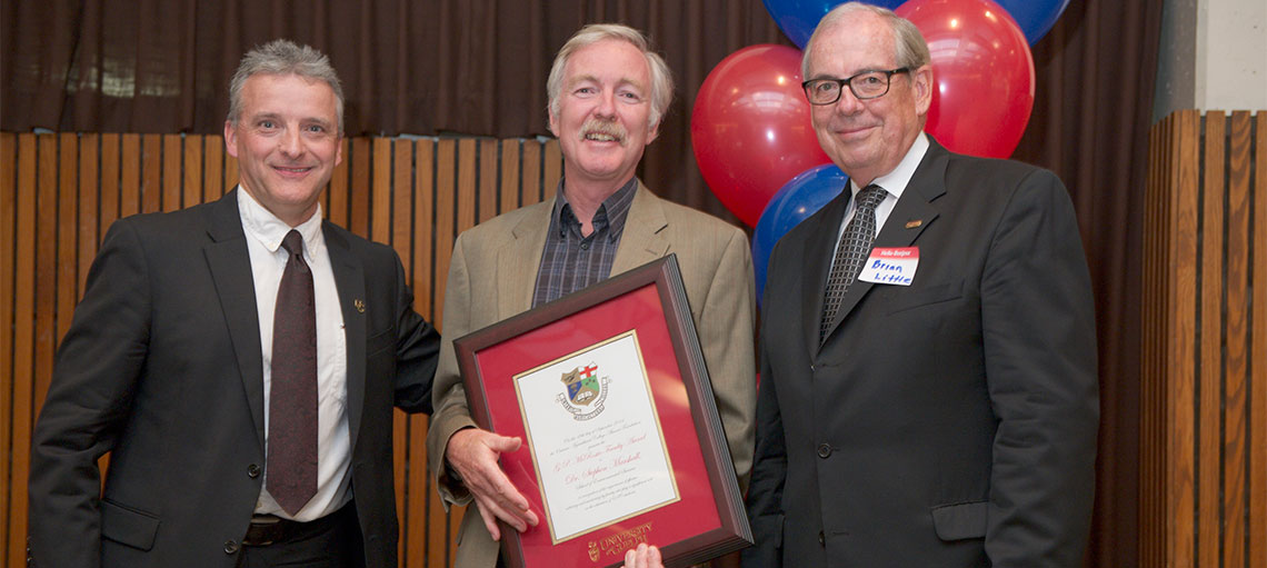 Rob Gordon and Brian Little present Prof. Steve Marshall with framed award