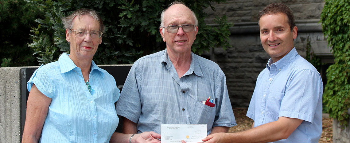 Jim and Brenda McIntosh present Associate Dean Rene Van Acker with their financial gift to the college