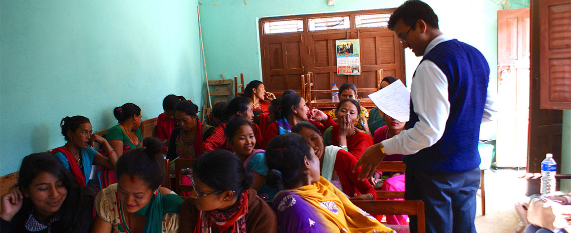 Young Nepali women in classroom learning from instructor.