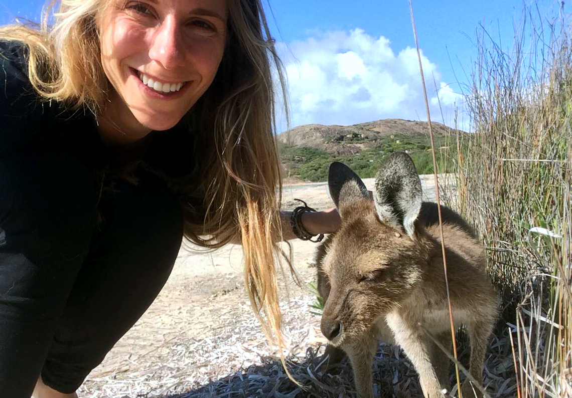 Kristi Storoschuk poses with a kangaroo in Australia.