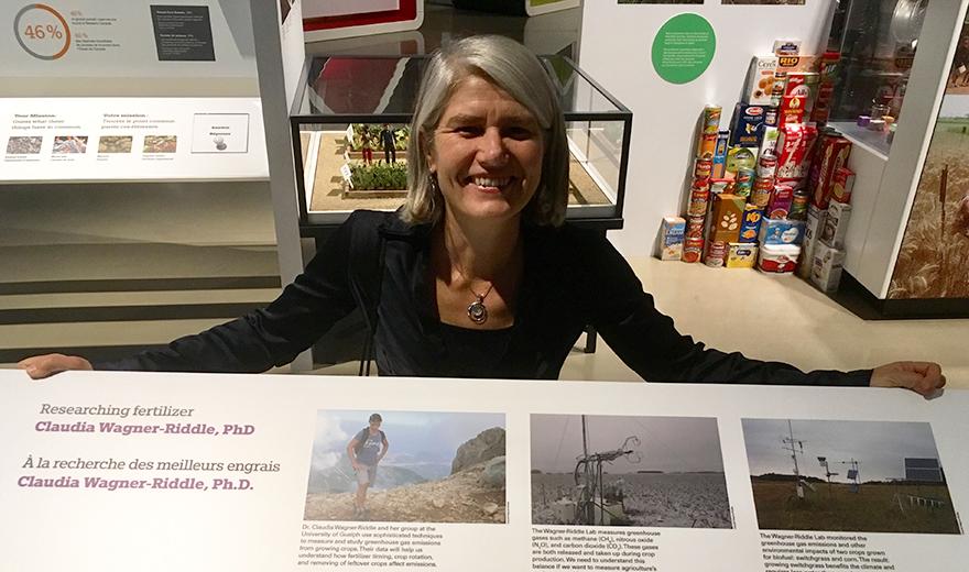 Claudia poses with her museum exhibit.