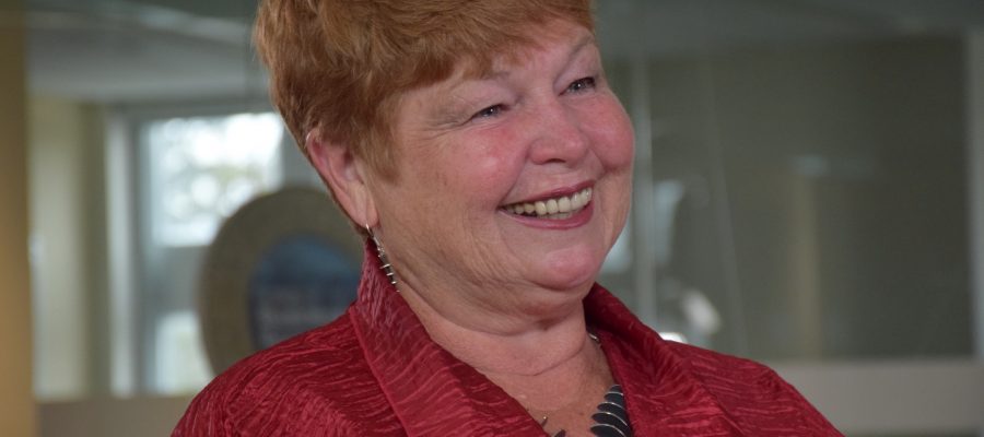 Robin-Lee Norris flashes a huge smile during an interview.