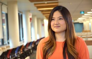 Semi-profile photograph of Esther Rhee looking thoughtful. 