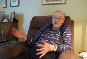 Hank Orr gestures with his hands as he tells a story from his past. 
