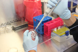 lab technician with petri dish