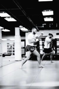 Black and white photo of man in a gym