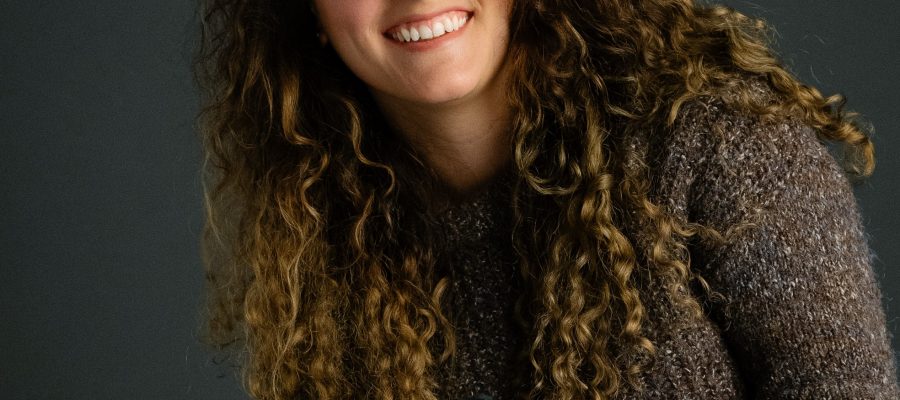 Smiling woman with camera