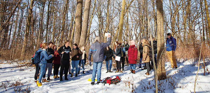 Students and teacher learning outside