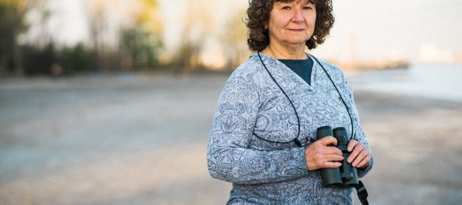 woman outdoors with binoculars