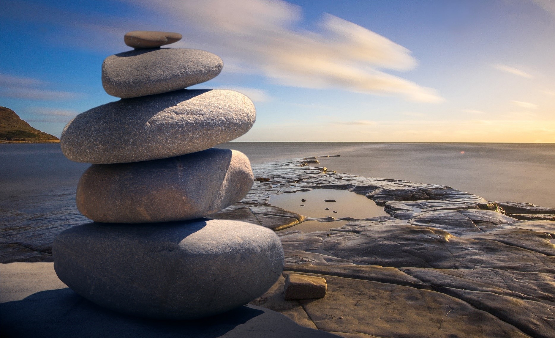 soothing image of rock pile and water