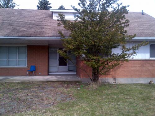 490 Stone Road East is a 1955 red brick two-storey home