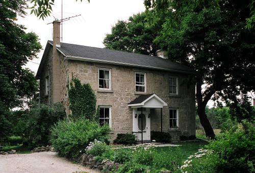 329 College Avenue East is a stone two-storey backing onto the Arboretum lands