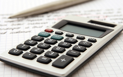 Calculator and notepad to represent Student Financial Services