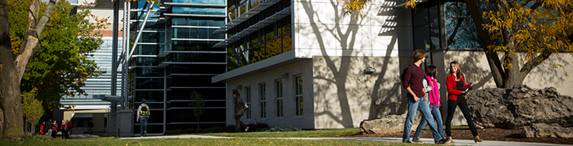 Students walking by Alexander Hall, on the University of Guelph campus