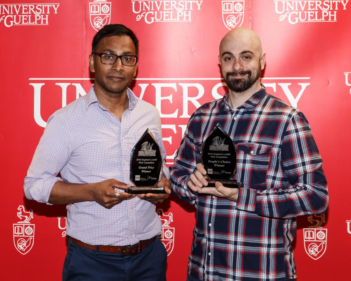 Sujeevan Ratnasingham, Grand Prize Winner, and Kevin Piunno, People's Choice Award Winner, stand with their trophies