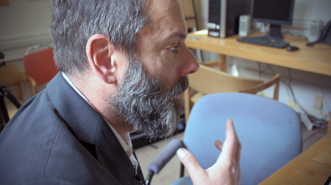 Photo of Mark Lipton gesturing with his hand