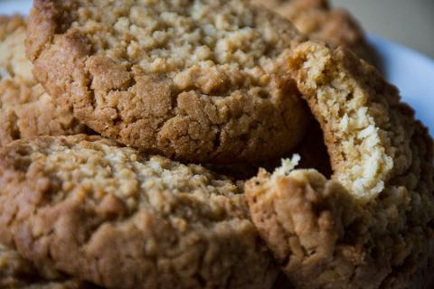 closeup of three gluten-free cookies, one with a bite taken out