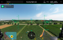 A view from the screen of the drone, showing a field and data.
