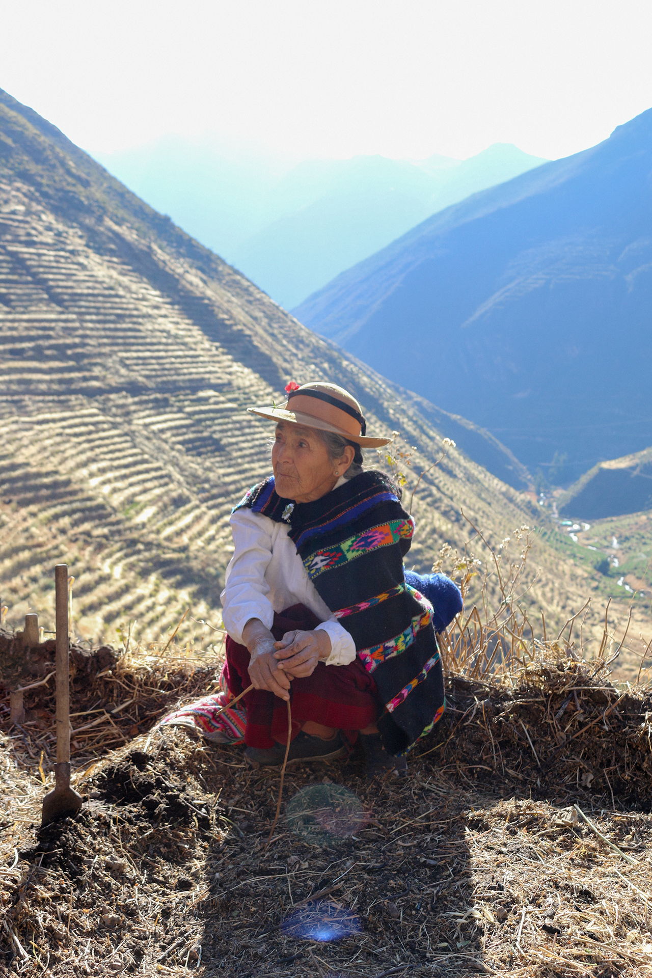 Andean woman preparing the land to plant the potatoes in Laraos, Peru