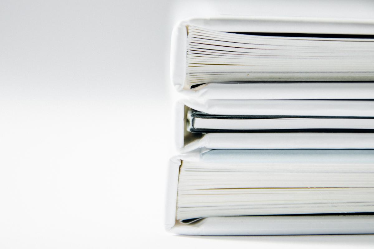 Stack of white binders