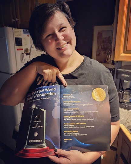 Ashleigh Weeden holding Municipal World magazine