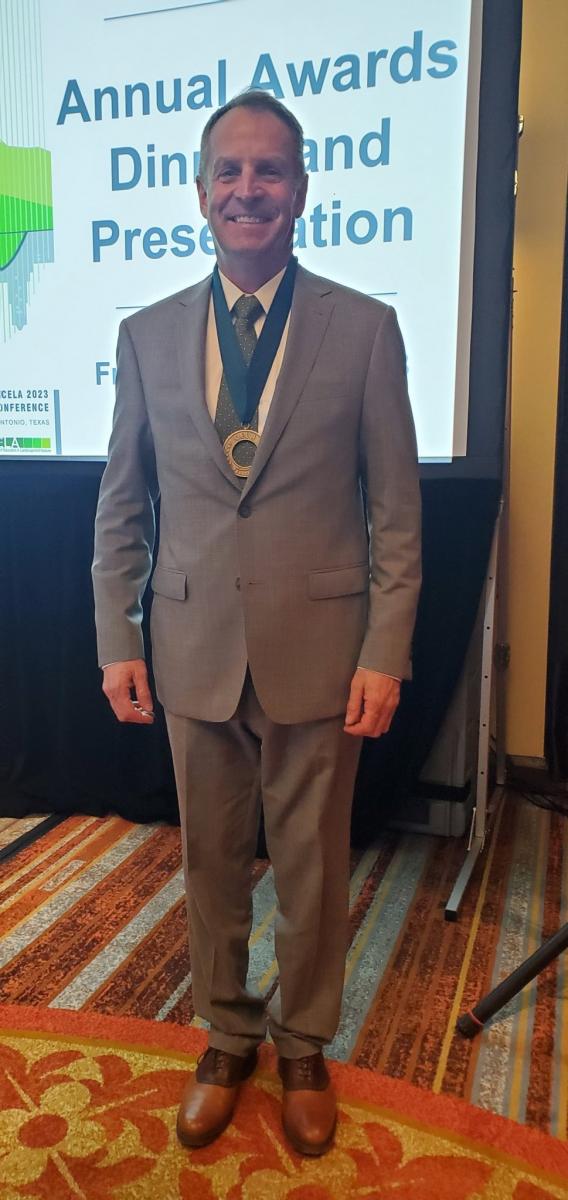 Dr. Robert Corry with FCELA medal on neck