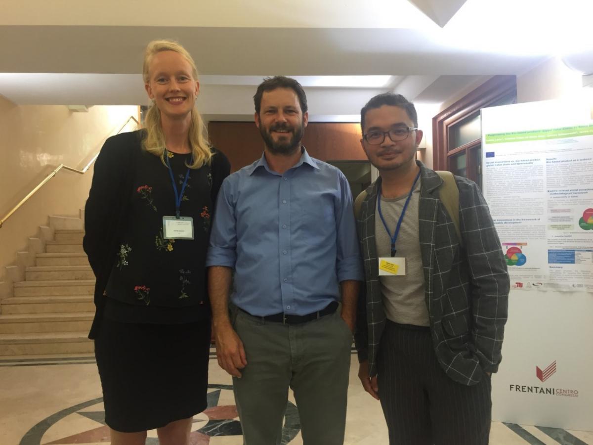 Three participants at the EU_SPRI poster session