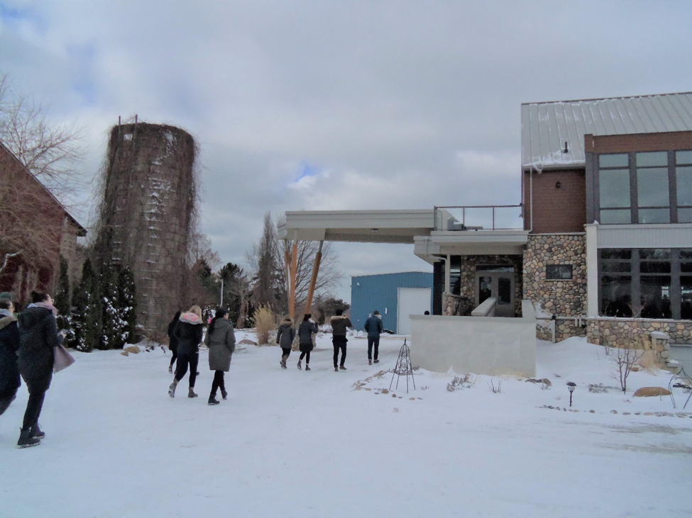 Students walking to front entrance of North 42 Winery building