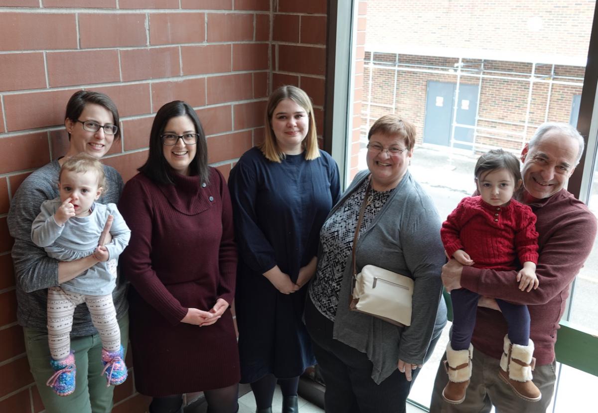 Lamontagne family with Beth Bray against brick wall